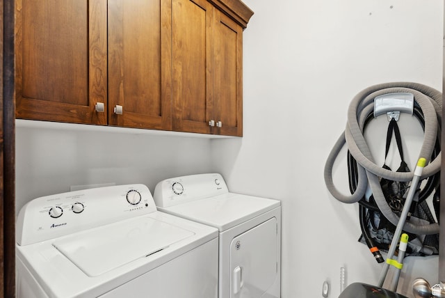 laundry area with cabinet space and washer and clothes dryer