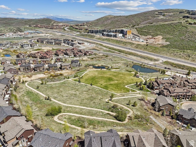 view of property location featuring nearby suburban area and a mountainous background
