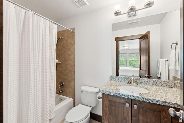 bathroom with shower / bath combination with curtain, vanity, and toilet