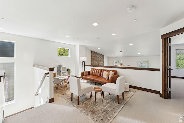 living area with baseboards, carpet, recessed lighting, and a ceiling fan