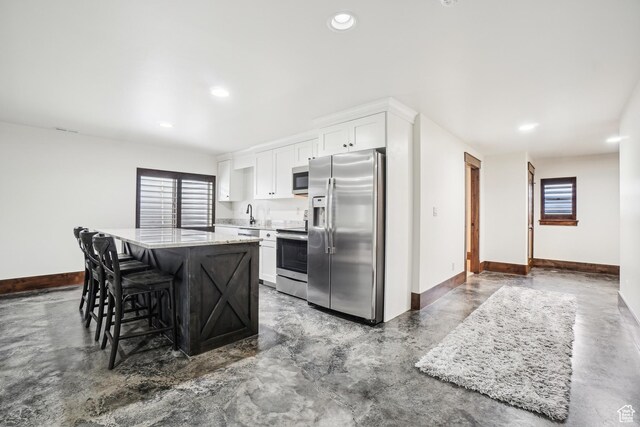 1236 S 2240 E, Heber City, UT 84032 - kitchen featuring stainless steel appliances, concrete flooring, baseboards, a kitchen island, and recessed lighting