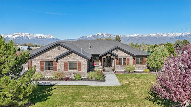 1236 S 2240 E, Heber City, UT 84032 - view of front of home with brick siding, a mountain view, and a front lawn