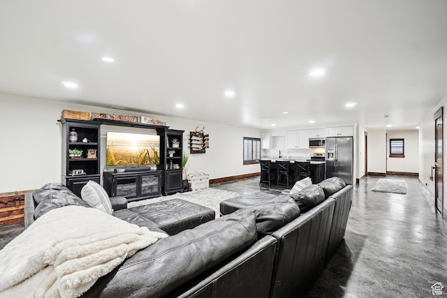 1236 S 2240 E, Heber City, UT 84032 - living room with baseboards, finished concrete flooring, and recessed lighting