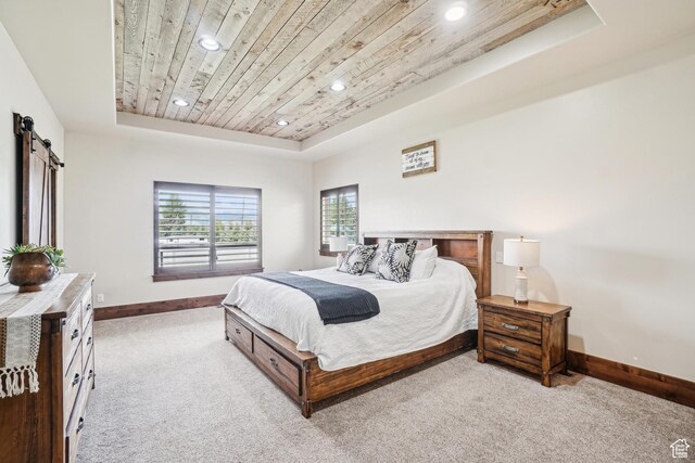 1236 S 2240 E, Heber City, UT 84032 - carpeted bedroom featuring a tray ceiling, recessed lighting, baseboards, wood ceiling, and a barn door