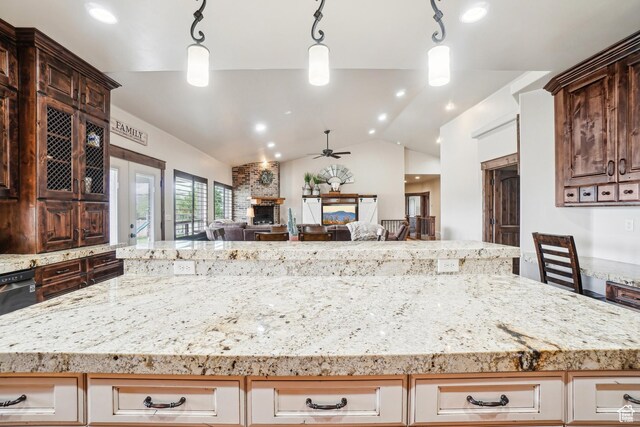 1236 S 2240 E, Heber City, UT 84032 - kitchen with a ceiling fan, vaulted ceiling, open floor plan, a fireplace, and light stone countertops