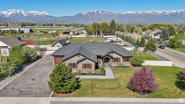 1236 S 2240 E, Heber City, UT 84032 - view of front facade featuring a mountain view, driveway, stone siding, and brick siding