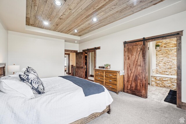 1236 S 2240 E, Heber City, UT 84032 - carpeted bedroom with a barn door, wood ceiling, recessed lighting, a tray ceiling, and connected bathroom