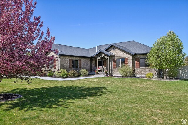 1236 S 2240 E, Heber City, UT 84032 - view of front facade with brick siding and a front lawn