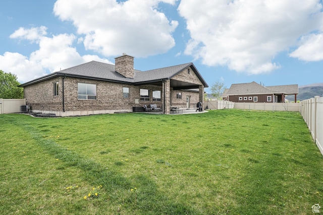 1236 S 2240 E, Heber City, UT 84032 - rear view of house with brick siding, a patio, a chimney, and central air condition unit