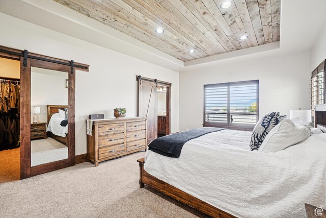 1236 S 2240 E, Heber City, UT 84032 - carpeted bedroom with a barn door, wood ceiling, a tray ceiling, recessed lighting, and a walk in closet