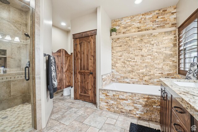 1236 S 2240 E, Heber City, UT 84032 - bathroom featuring a stall shower, a bath, recessed lighting, vanity, and stone finish floors