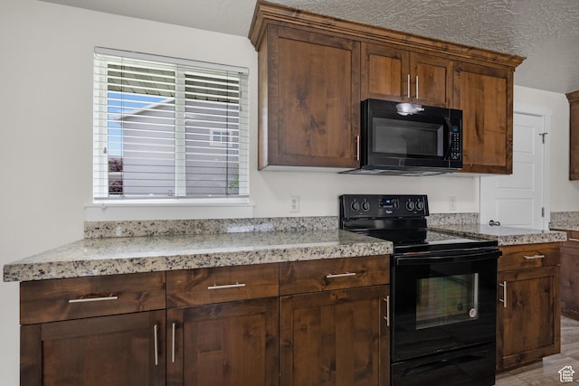 6594 S 1300 W, Taylorsville, UT 84123 - kitchen with black appliances, plenty of natural light, a textured ceiling, and light stone counters