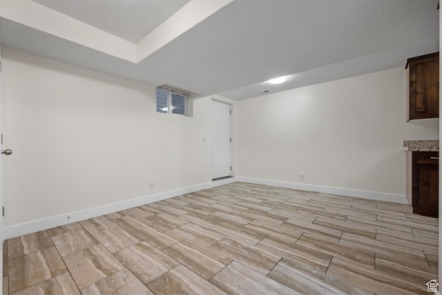 6594 S 1300 W, Taylorsville, UT 84123 - unfurnished living room with baseboards and light wood-style floors
