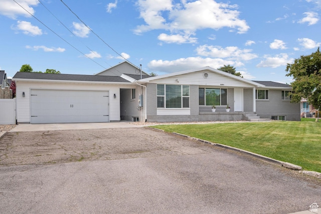 6594 S 1300 W, Taylorsville, UT 84123 - single story home with driveway, a garage, a front yard, and brick siding