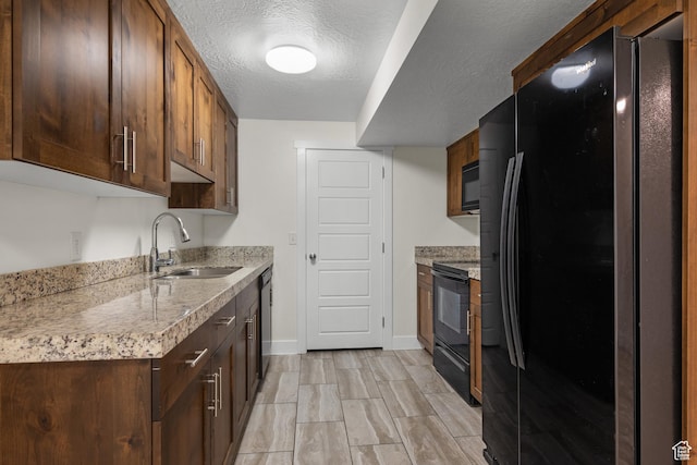 6594 S 1300 W, Taylorsville, UT 84123 - kitchen with black appliances, a sink, baseboards, and a textured ceiling