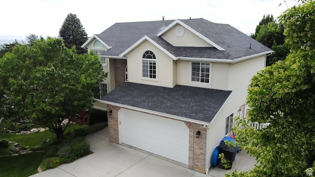 3139 N 800 E, North Ogden, UT 84414 - traditional home featuring brick siding, concrete driveway, and roof with shingles