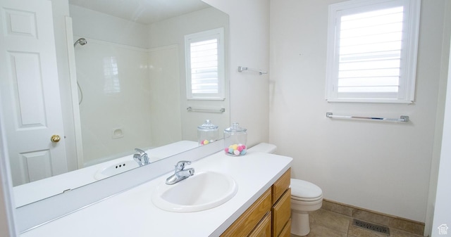 3139 N 800 E, North Ogden, UT 84414 - full bath featuring toilet, vanity, tile patterned floors, and a shower