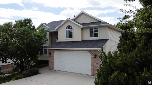 3139 N 800 E, North Ogden, UT 84414 - traditional-style home featuring driveway, an attached garage, brick siding, stucco siding, and a shingled roof