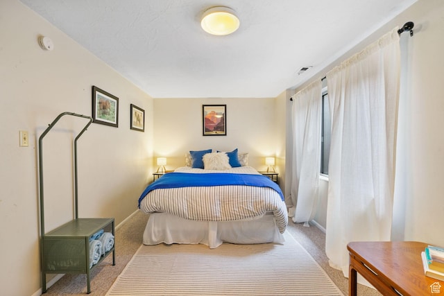 carpeted bedroom with baseboards