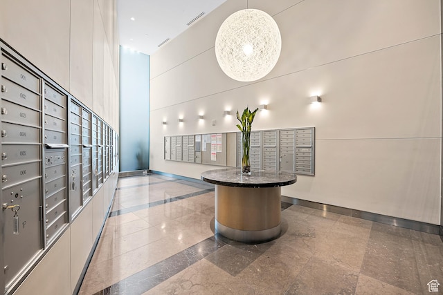 35 E 100 S Unit 507, Salt Lake City, UT 84111 - surrounding community featuring mail area, a towering ceiling, and a package area