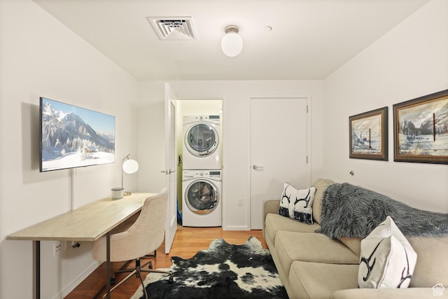 35 E 100 S Unit 507, Salt Lake City, UT 84111 - laundry room featuring stacked washer / drying machine, wood finished floors, and a desk