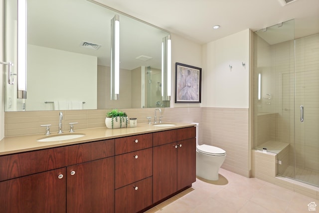 35 E 100 S Unit 507, Salt Lake City, UT 84111 - full bath with tile walls, a stall shower, double vanity, toilet, and tile patterned flooring