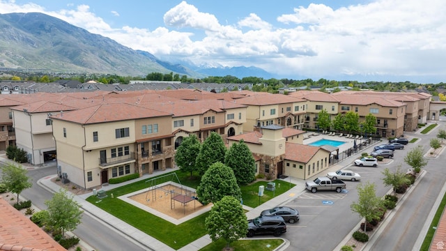 10926 N Marsala Dr, Highland, UT 84003 - aerial view of residential area featuring a pool and a mountainous background