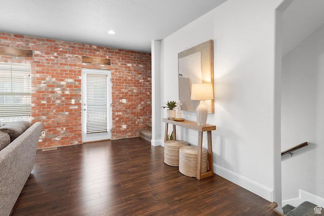 10926 N Marsala Dr, Highland, UT 84003 - living area featuring brick wall, baseboards, wood finished floors, and stairway
