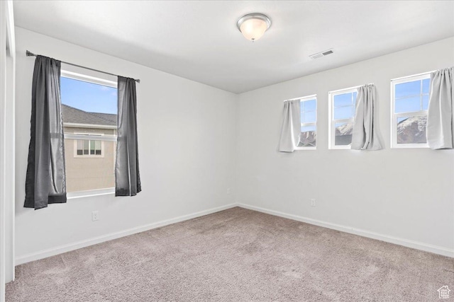 6405 N Appaloosa Dr, Stansbury Park, UT 84074 - carpeted spare room with plenty of natural light and baseboards