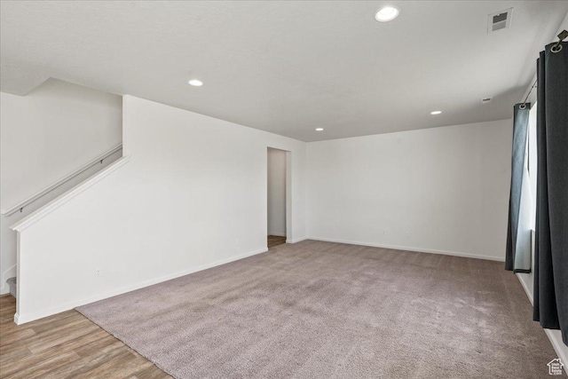 6405 N Appaloosa Dr, Stansbury Park, UT 84074 - spare room featuring recessed lighting, baseboards, and stairway