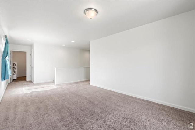 6405 N Appaloosa Dr, Stansbury Park, UT 84074 - empty room featuring light colored carpet, baseboards, and recessed lighting