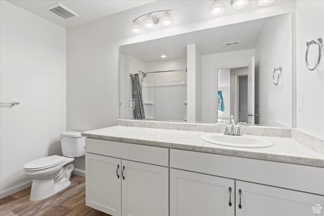 6405 N Appaloosa Dr, Stansbury Park, UT 84074 - full bathroom with toilet, wood finished floors, baseboards, a shower with curtain, and vanity