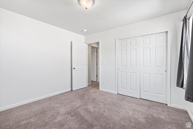 6405 N Appaloosa Dr, Stansbury Park, UT 84074 - unfurnished bedroom with carpet flooring, baseboards, and a closet