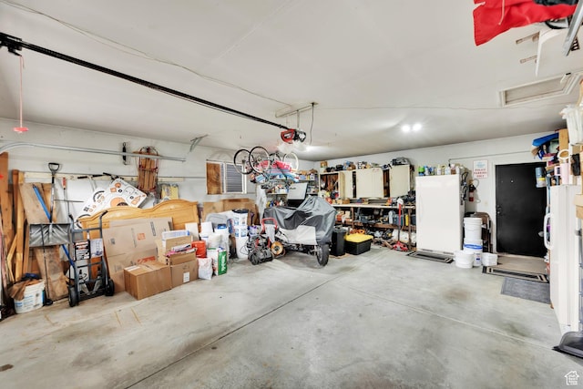 2298 W Jordan Meadows Cv, West Jordan, UT 84084 - garage featuring a garage door opener