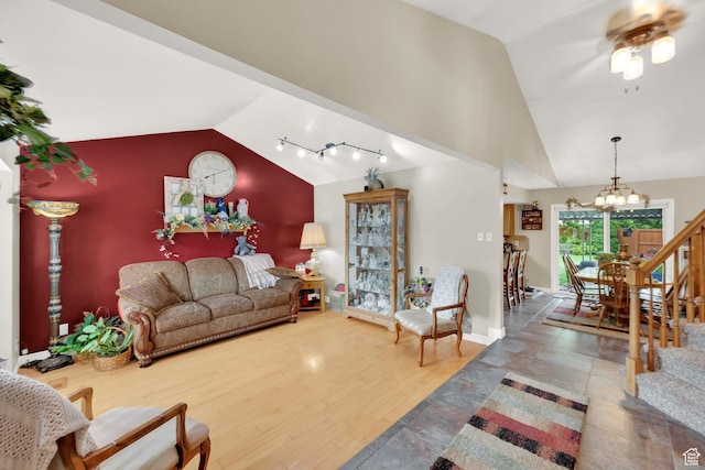 2298 W Jordan Meadows Cv, West Jordan, UT 84084 - living room featuring a chandelier, a ceiling fan, baseboards, and high vaulted ceiling