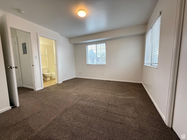 136 E 400 N Unit 108, Provo, UT 84606 - unfurnished bedroom featuring dark carpet, baseboards, and ensuite bath