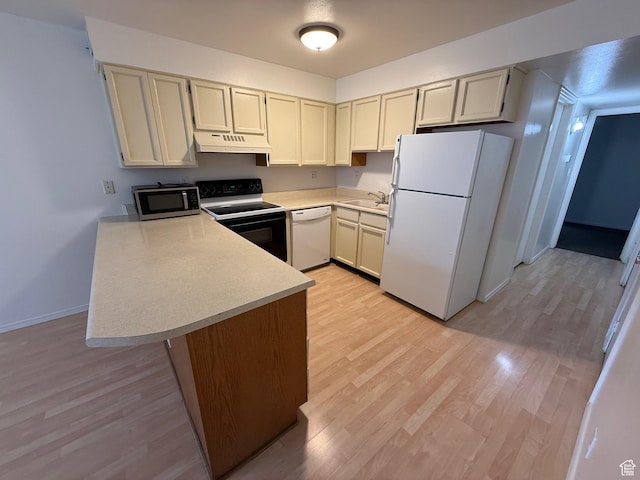 136 E 400 N Unit 108, Provo, UT 84606 - kitchen featuring white appliances, under cabinet range hood, a sink, a peninsula, and light countertops