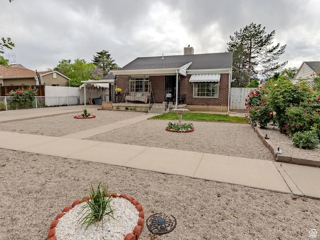 657 N Rambler Dr N, Salt Lake City, UT 84116 - bungalow with brick siding, fence, and a chimney