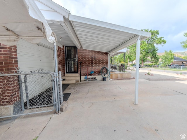 657 N Rambler Dr N, Salt Lake City, UT 84116 - view of patio / terrace with a carport, fence, and a gate