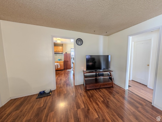 657 N Rambler Dr N, Salt Lake City, UT 84116 - living room featuring wood finished floors, a textured ceiling, and baseboards