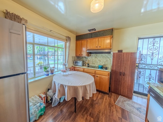 657 N Rambler Dr N, Salt Lake City, UT 84116 - kitchen featuring freestanding refrigerator, wood finished floors, dishwasher, decorative backsplash, and light countertops