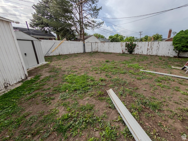 657 N Rambler Dr N, Salt Lake City, UT 84116 - fenced backyard featuring a storage shed and an outdoor structure
