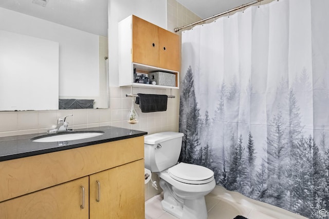 full bath featuring toilet, tile patterned floors, tile walls, vanity, and a shower with curtain