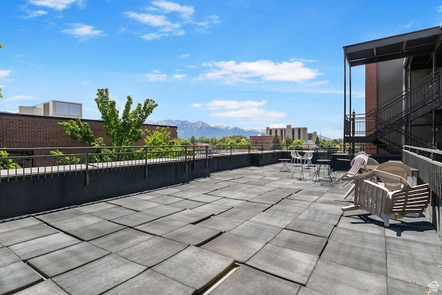 view of patio featuring a mountain view and outdoor dining area