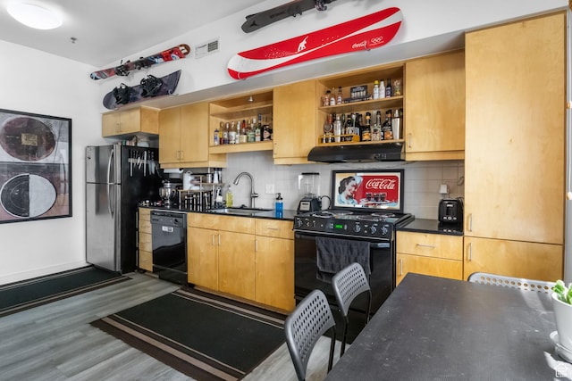 kitchen with black appliances, dark countertops, open shelves, and a sink