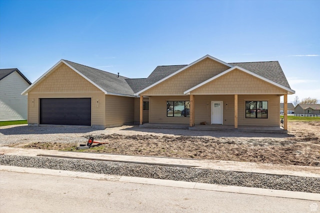 562 Eagle Dr, Preston, ID 83263 - craftsman-style house with driveway, a garage, and covered porch