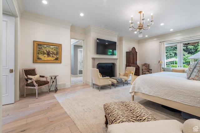 bedroom with light wood finished floors, a fireplace, a chandelier, recessed lighting, and crown molding