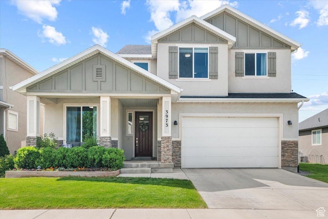 craftsman inspired home with board and batten siding, stone siding, a garage, concrete driveway, and a front yard