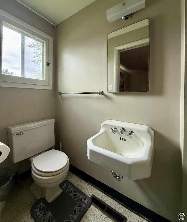 479 S Vernal Ave, Vernal, UT 84078 - half bath with speckled floor, toilet, and a sink