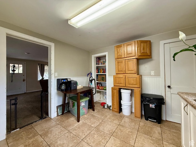 479 S Vernal Ave, Vernal, UT 84078 - kitchen featuring wainscoting, light tile patterned flooring, and light countertops